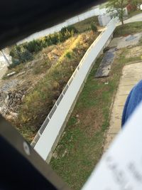 High angle view of road along grass