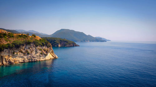 Scenic view of sea against clear blue sky