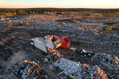 Landfill waste disposal. garbage dump with waste plastic. garbage truck unload rubbish in landfill. 