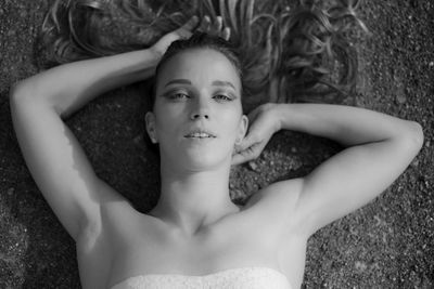 Portrait of young woman lying down