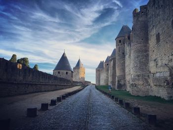 Footpath amidst historical buildings