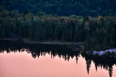 Autumn forest landscape and reflection in the lake at sunset. la mauricie national park, canada.