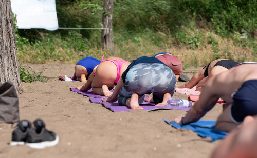 Group of people relaxing on land