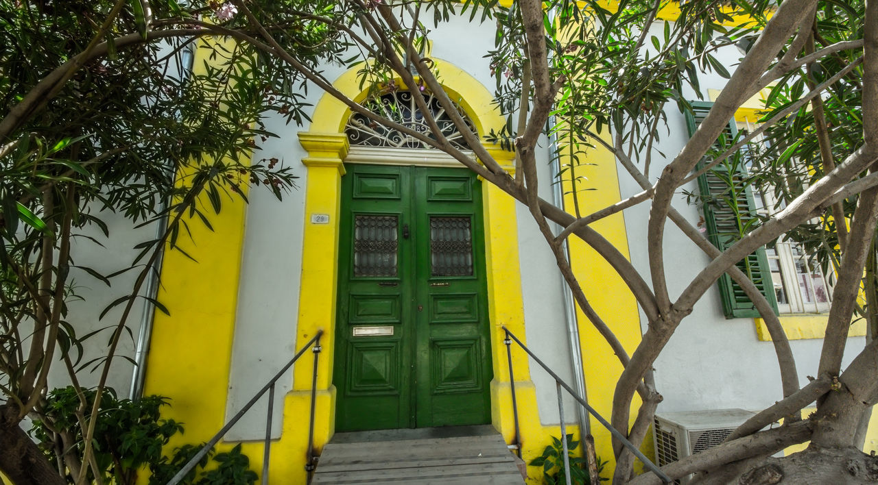 YELLOW DOOR OF BUILDING