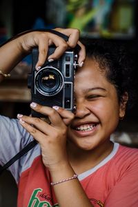 Portrait of woman photographing