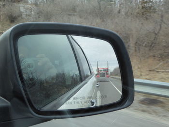 Reflection of car on side-view mirror