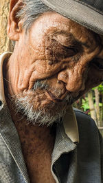 Close-up of man looking through window