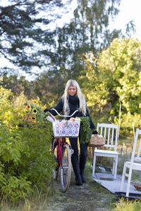 Young woman with bicycle, stockholm, sweden