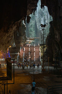 People outside temple by building