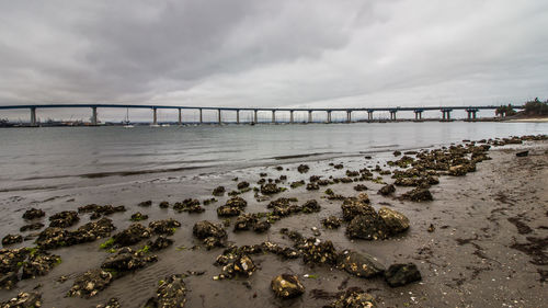 Bridge over sea against sky