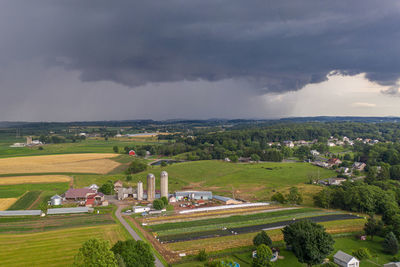 High angle view of trees and buildings against sky