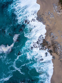 High angle view of surf on beach