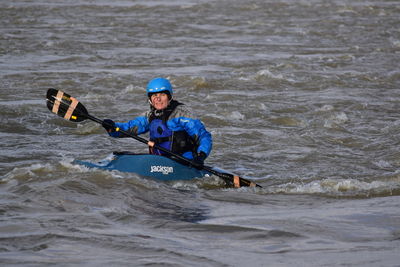 Full length of man surfing on sea