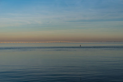 Scenic view of sea against sky at sunset