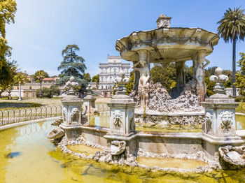 Statue of fountain in pond