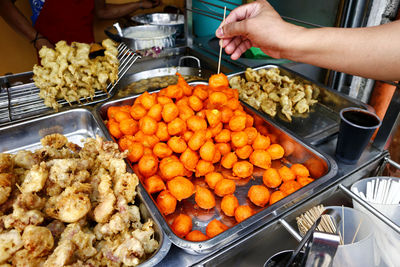 High angle view of person having food in market