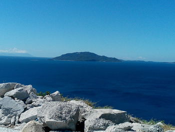 Scenic view of sea against blue sky