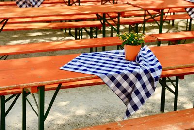 Potted plant and checked fabric on table