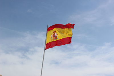 Low angle view of flag against sky