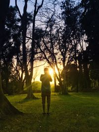 Full length of silhouette man on golf course