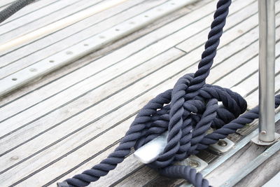 Close-up of rope tied on wood