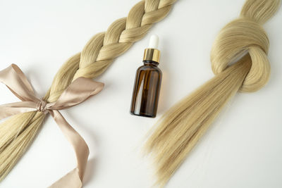 High angle view of beauty products against white background