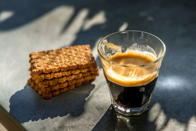 Close-up of coffee and drink on table