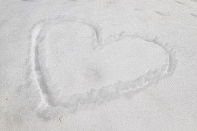 High angle view of heart shape on snow