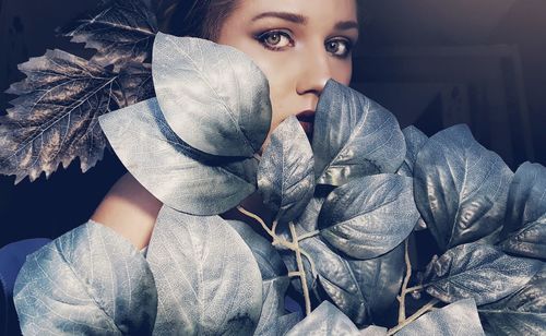 Portrait of woman by plants