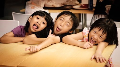 Portrait of three funny children