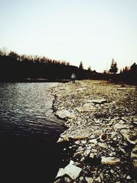 Scenic view of calm lake at sunset