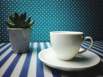 Close-up of coffee cup on table