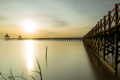 Scenic view of bridge against sky during sunset
