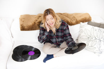 Young woman listening to music