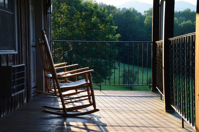 Empty chairs and tables in balcony