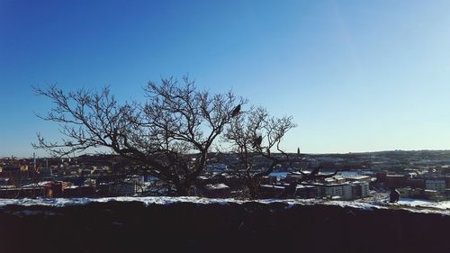 View of landscape against clear blue sky