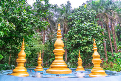 Low angle view of chess amidst trees in temple