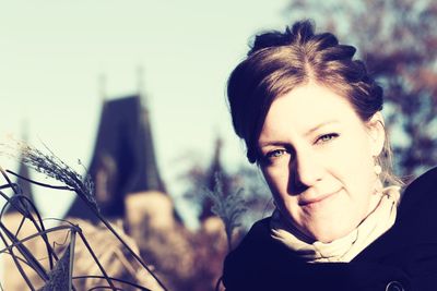 Portrait of woman smiling outdoors