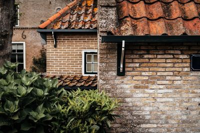 Low angle view of brick wall of building