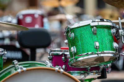 A set of plates in a drum set. at a concert of percussion music, selective focus, close-up