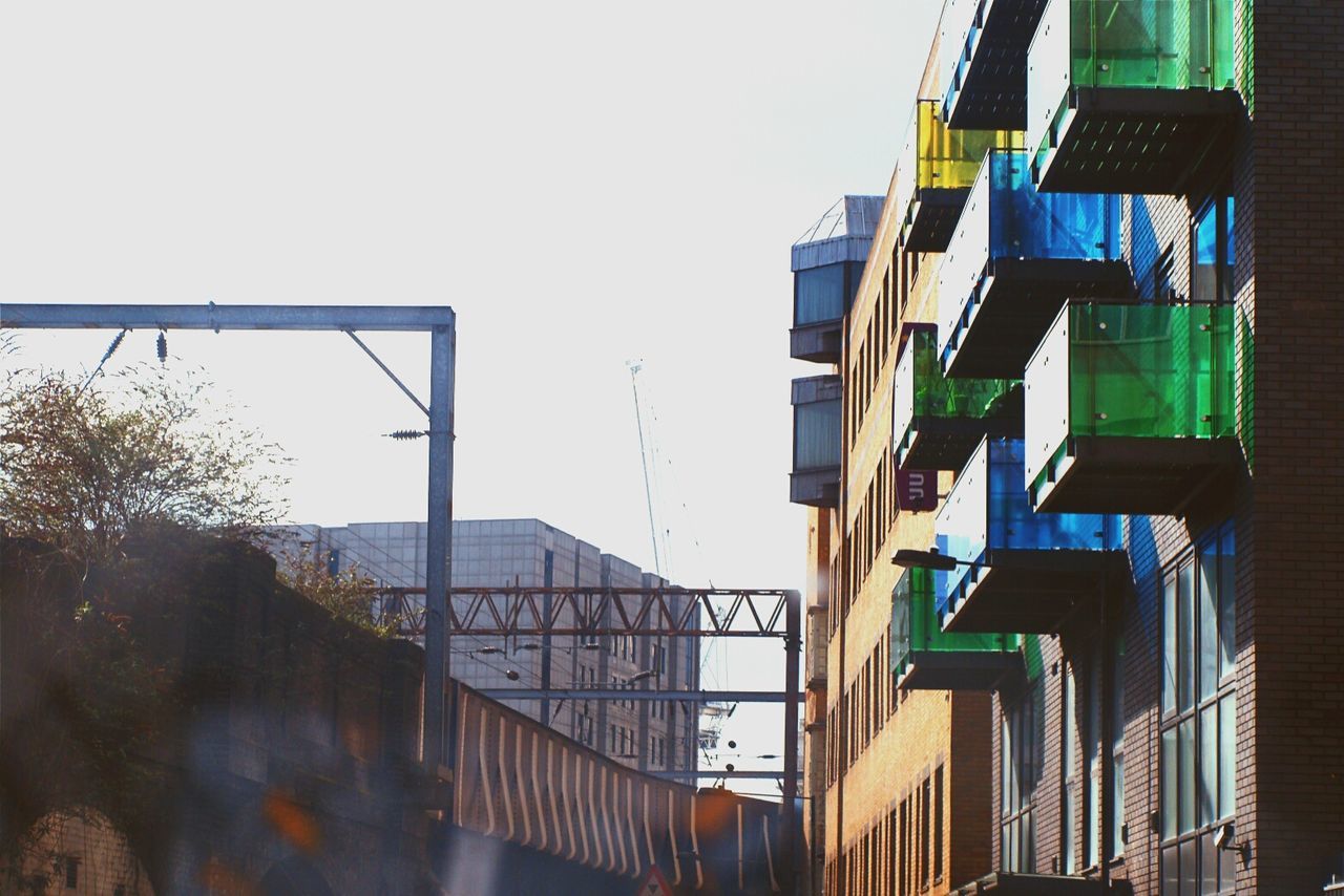 architecture, building exterior, built structure, low angle view, clear sky, residential building, residential structure, window, building, city, house, day, balcony, apartment, outdoors, sky, no people, modern, office building, residential district