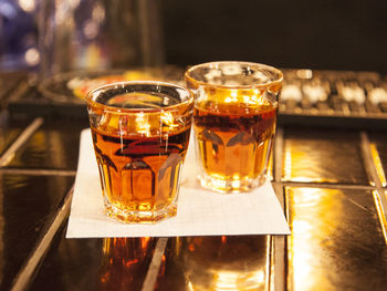 Close-up of fresh liquor drinks on bar counter