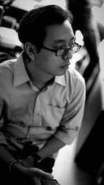 Rear view of man looking at camera