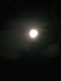 Low angle view of moon in sky at night