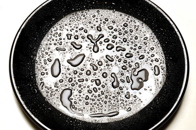 Close-up of water drops on plate