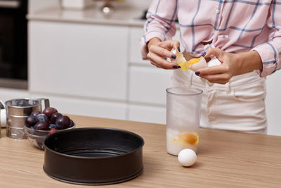 Midsection of woman preparing food