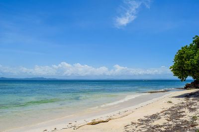 Scenic view of sea against blue sky