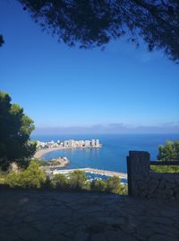 Scenic view of sea against clear blue sky