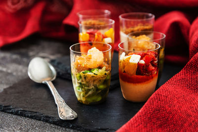 Close-up of food in glasses on slate