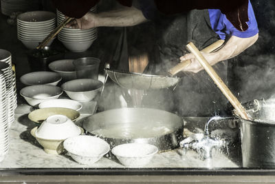 Midsection of person preparing food